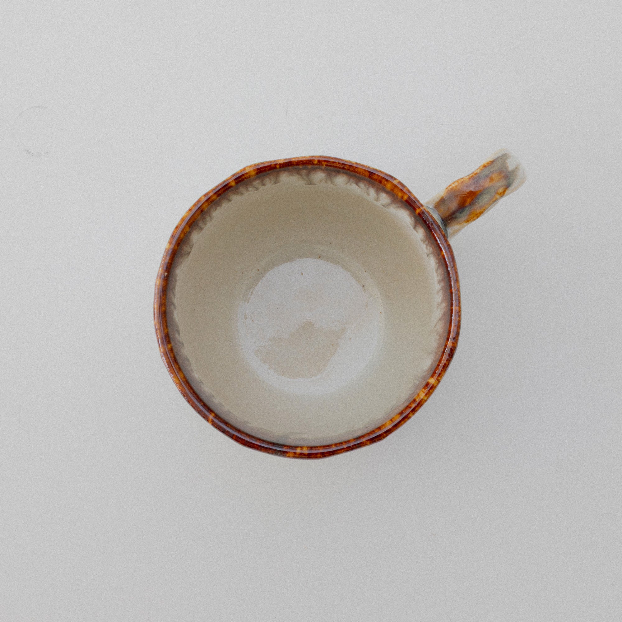 Top view of the brown and white cup