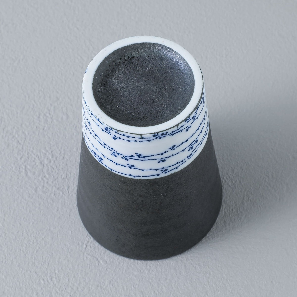 bottow view of the grey and white tea cup