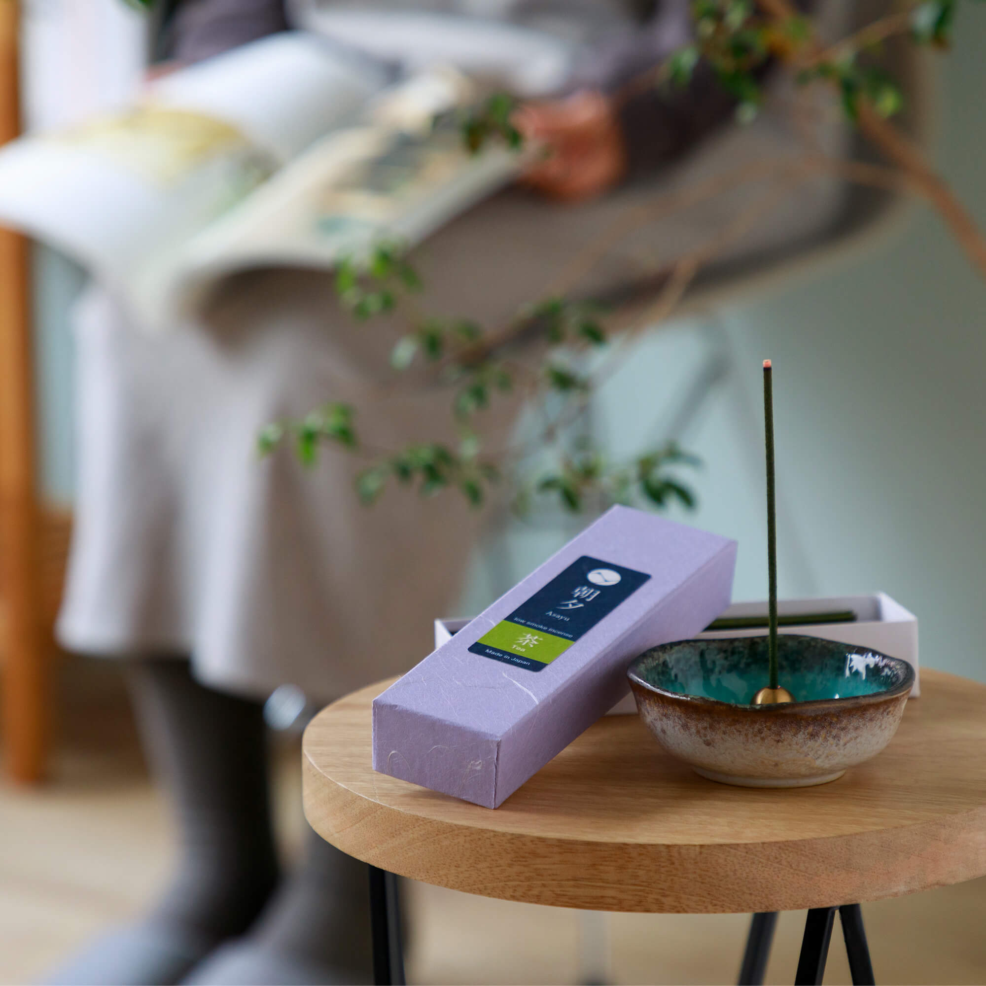 Green Tea incense with incense hlder on a stool
