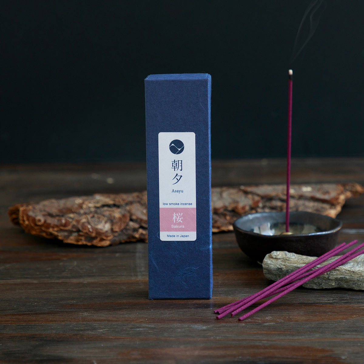 Sakura incense box next to a price of wood bark and incense holder