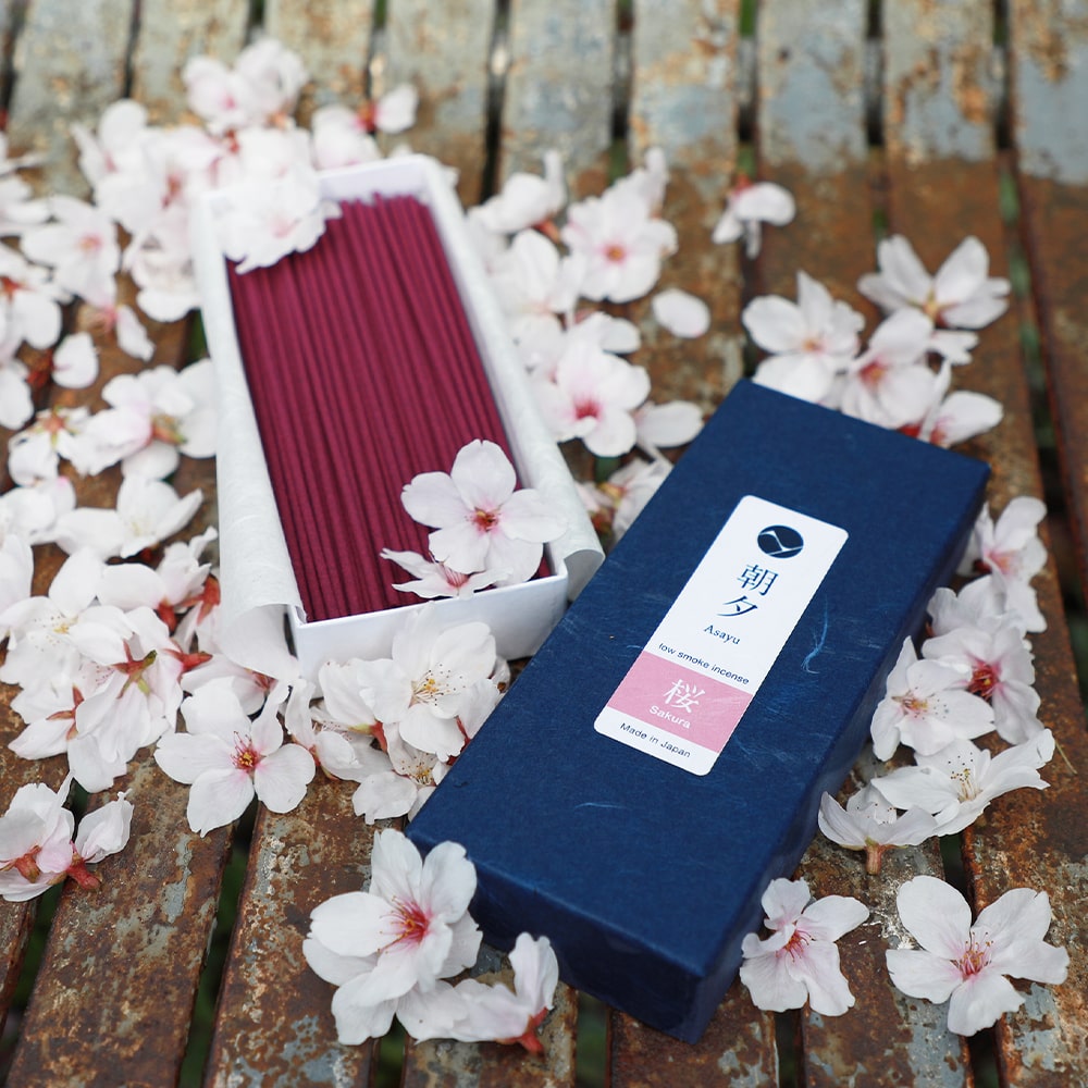 Open box of Asayu Japan Sakura Cherry Blossom Low Smoke Incense Sticks with sakura petals inside