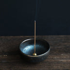Frankincense traditional incense stick burning in an incense holder