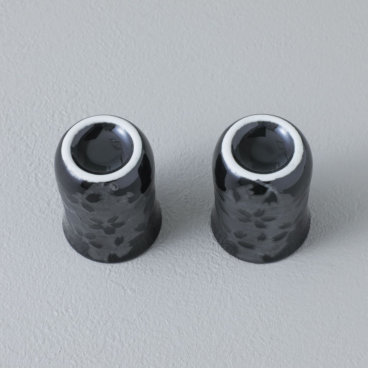 bottom view of two sake cups