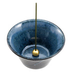 cone shaped blue and black incense holder