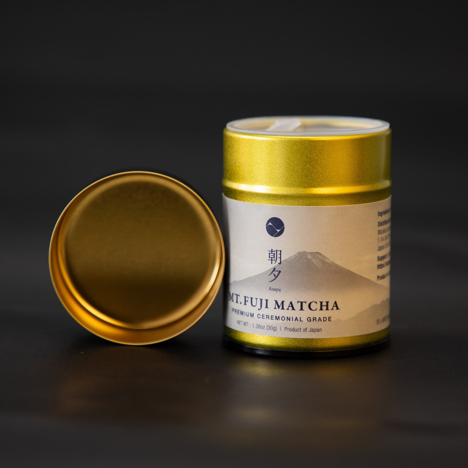 Gold canister of Mt. Fuji Matcha on a black background