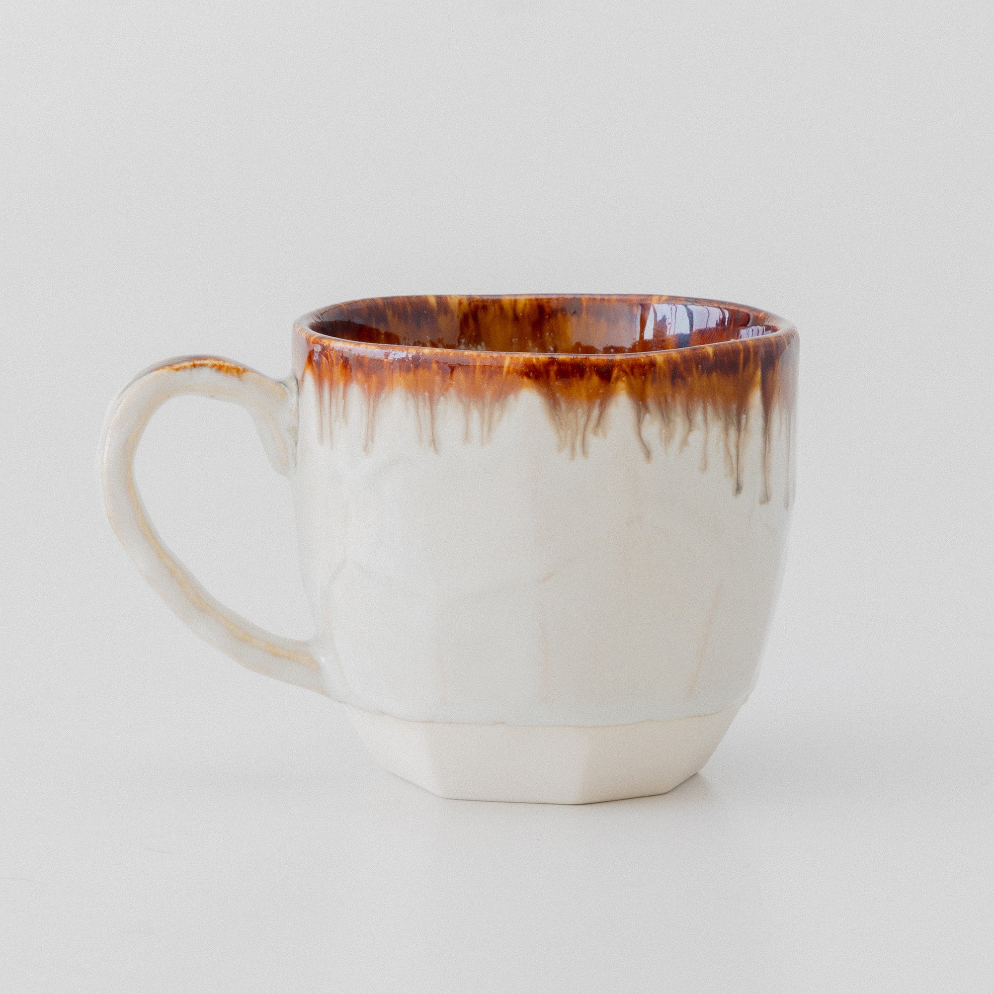 side view of the brown and white cup