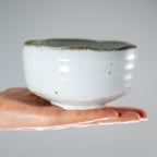 hand holding shirotsuchi white and brown Matcha Bowl