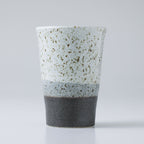 ceramic grey tea cup on grey background