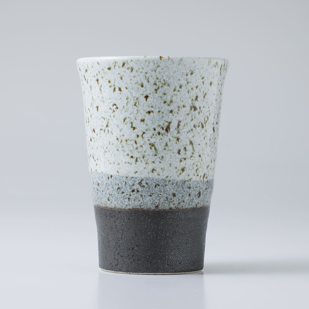 ceramic grey tea cup on grey background