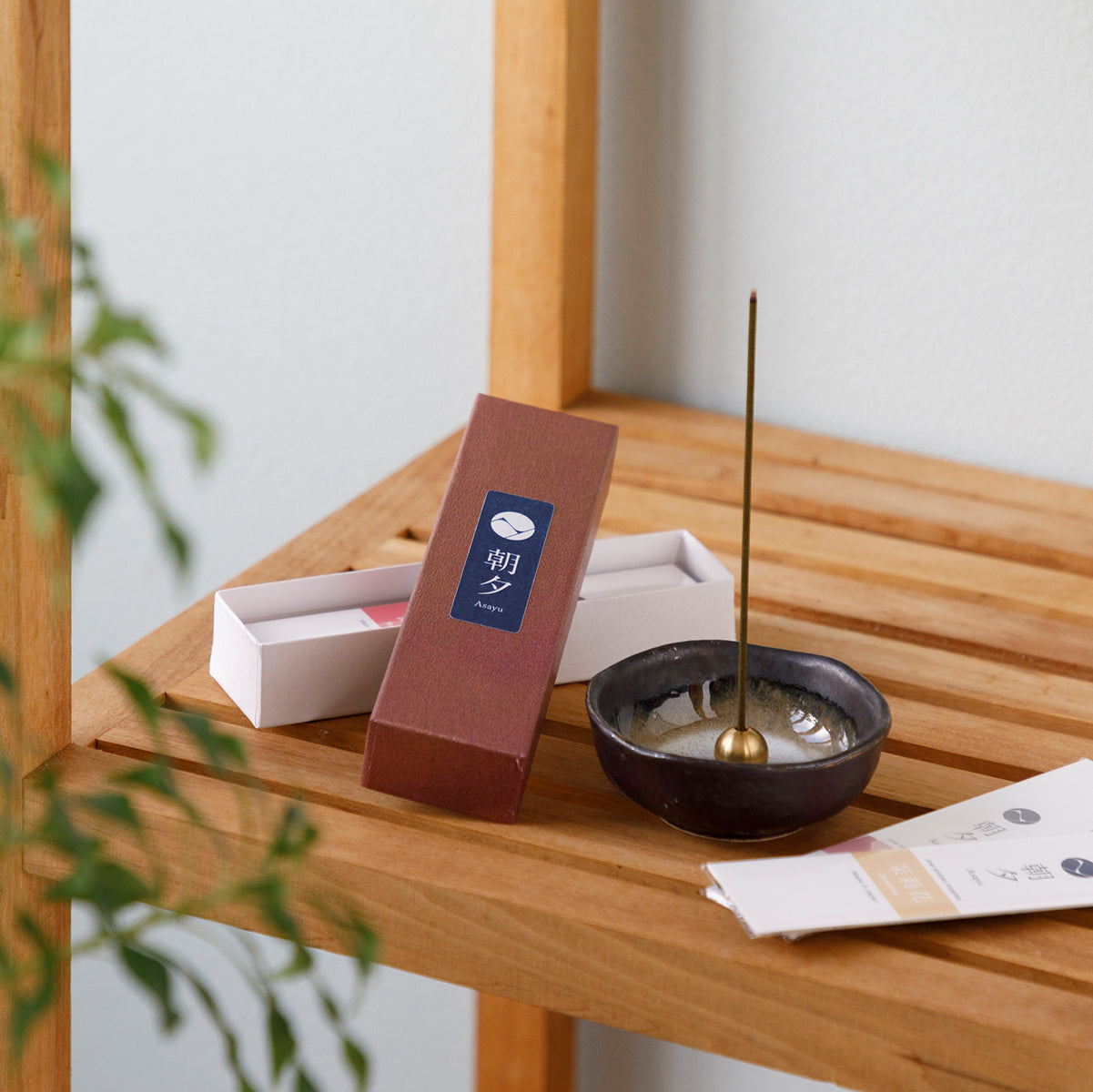 Floral incense sticks variety pack with incense holder on wood shelf
