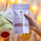hand holding a pouch of asayu gyokuro and genmaicha tea bags