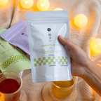 hand holding an asayu pouch of gyokuro tea bags