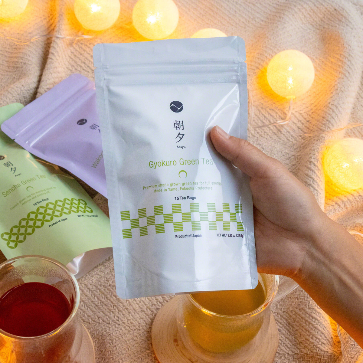 hand holding an asayu pouch of gyokuro tea bags