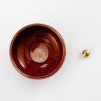 orange ceramic holder with brass holder