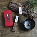 cinnamon and juniper incense sticks set with incense holder and wood bark