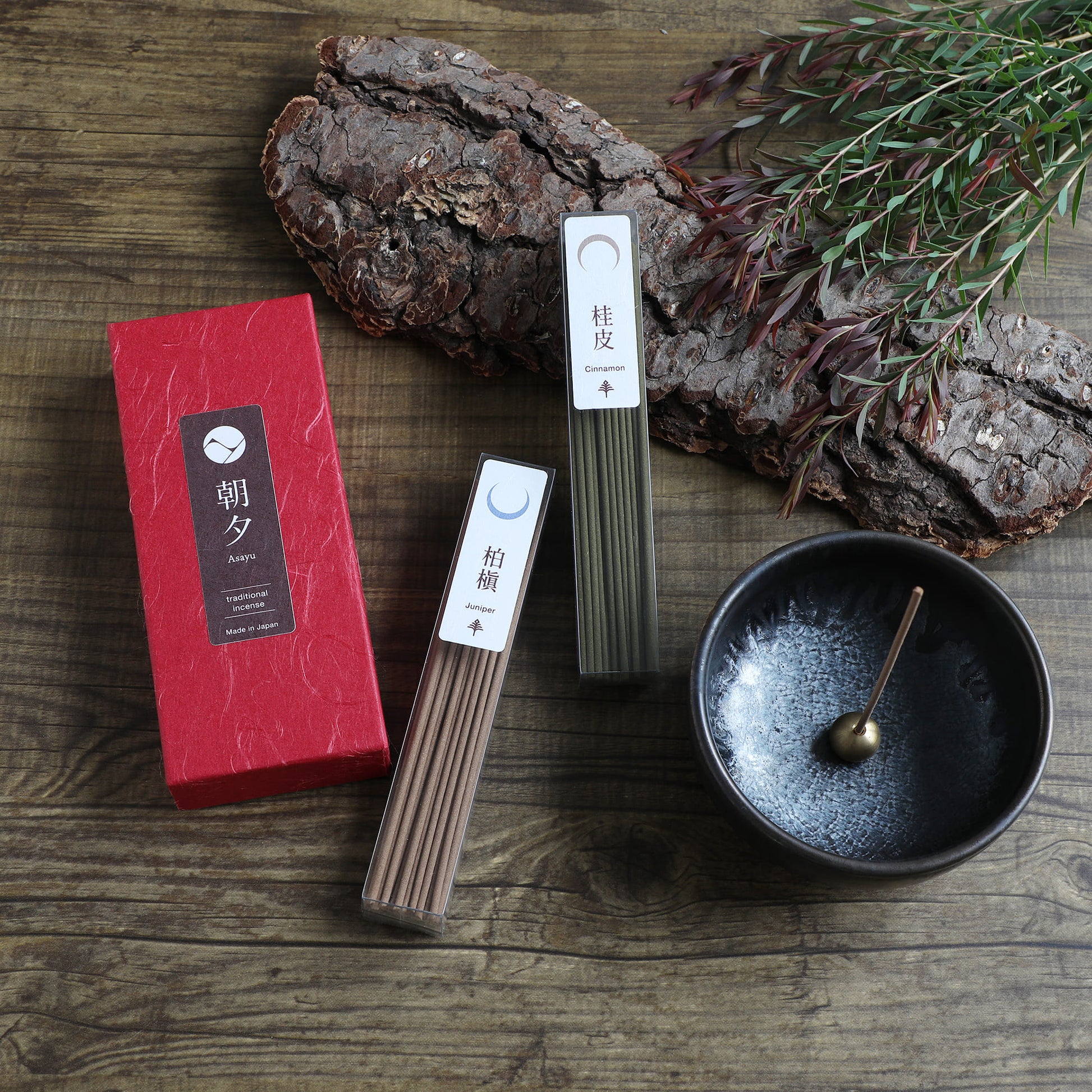 cinnamon and juniper incense sticks set with incense holder and wood bark