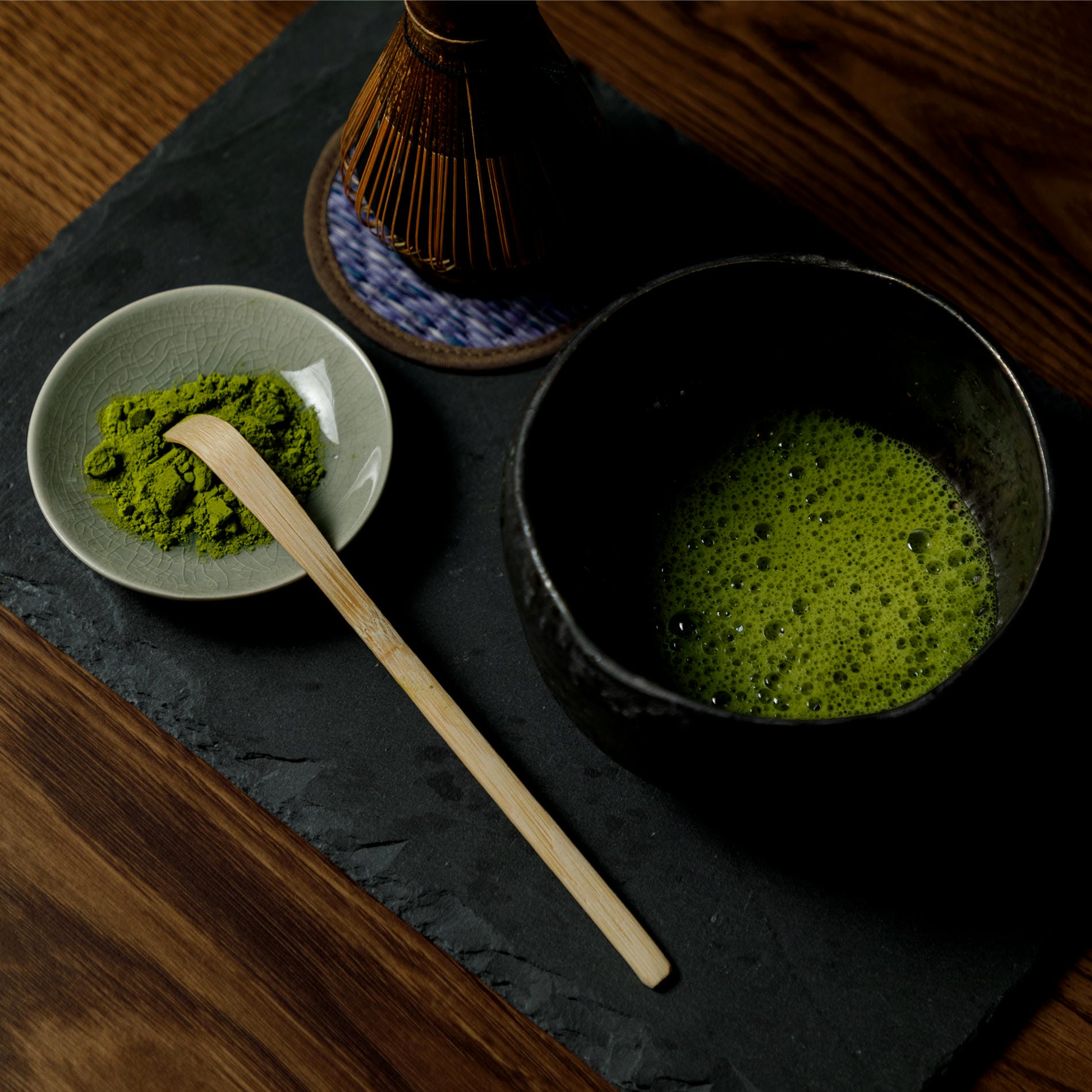 Matcha Tea Powder and a bowl with matcha drink