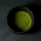 A bowl with matcha tea inside
