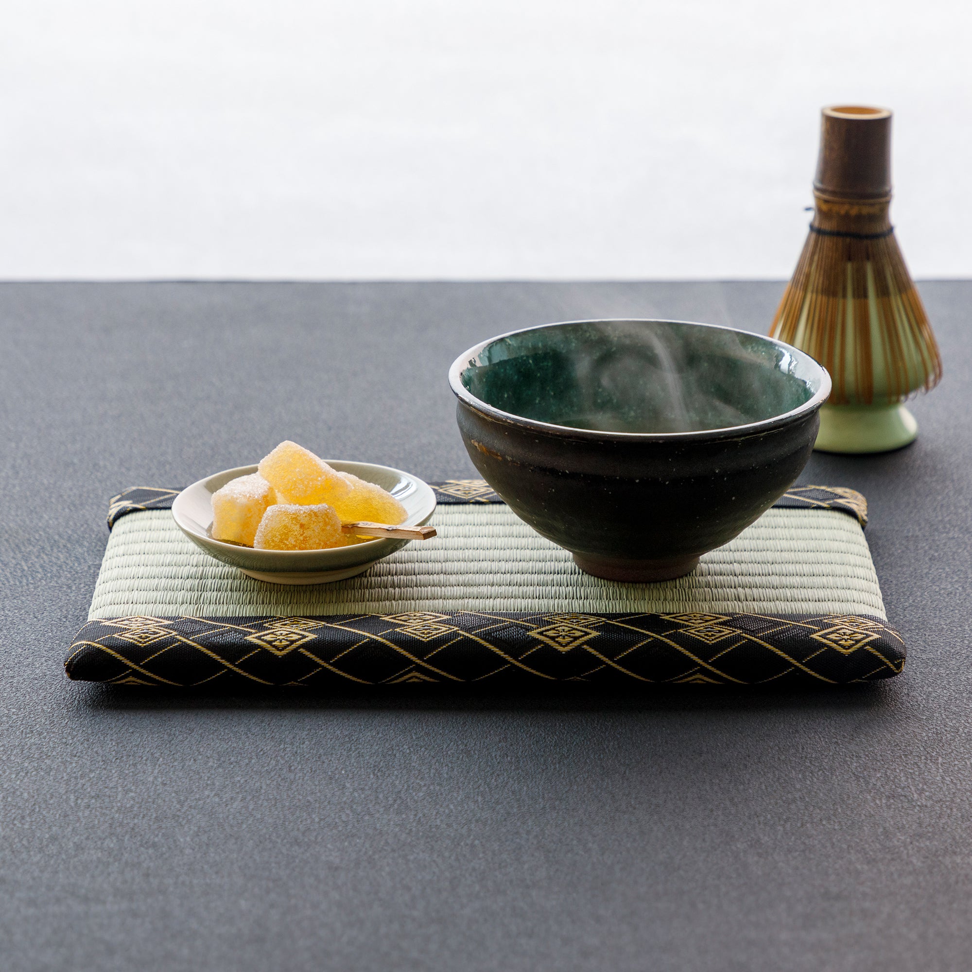 mini tatami mat with match bowl and sweets on plate