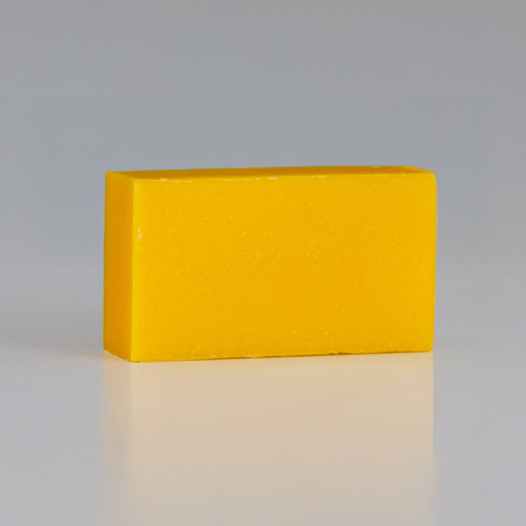 persimmon soap bar on grey background