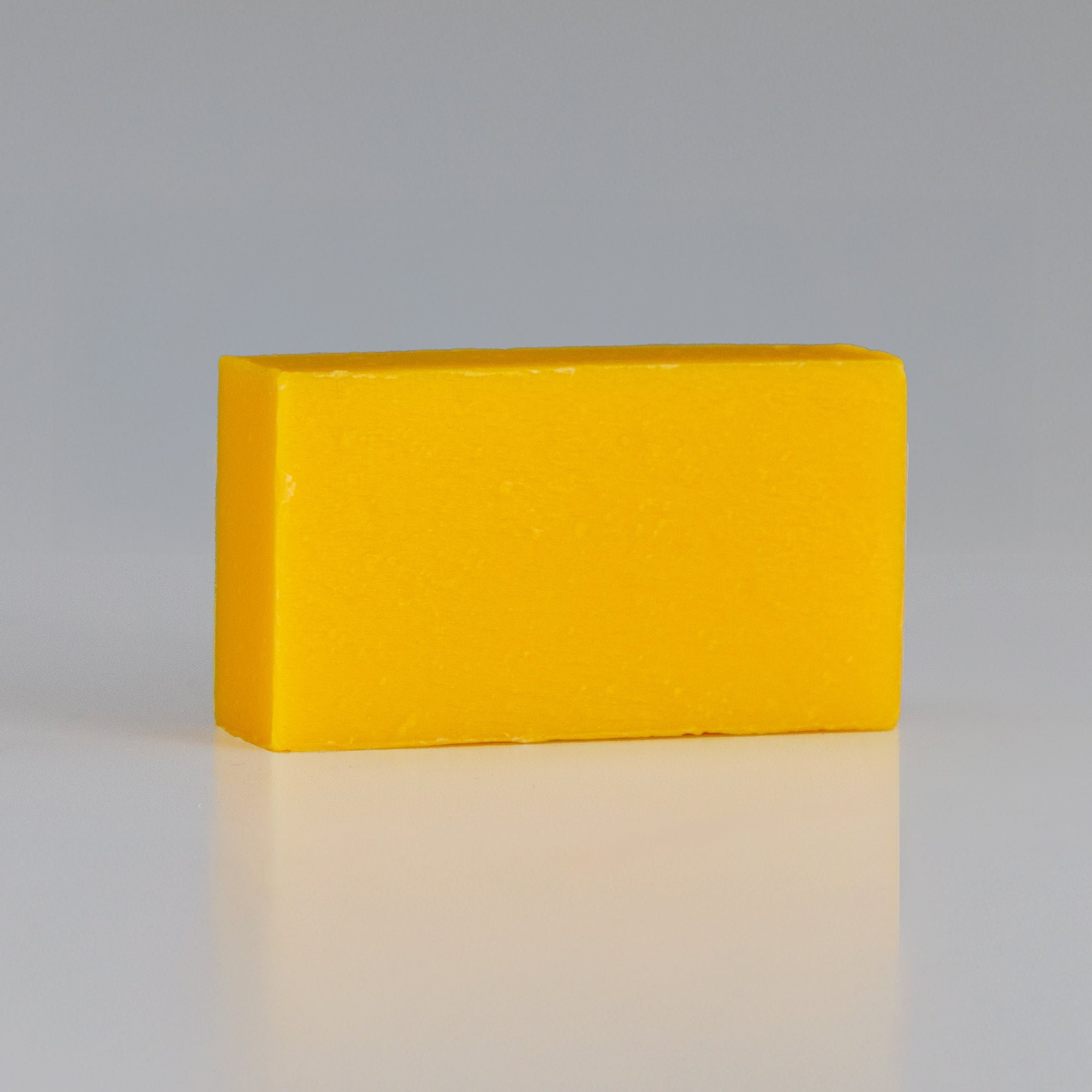 persimmon soap bar on grey background