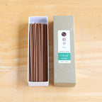 20g patchouli incense sticks box on woody background