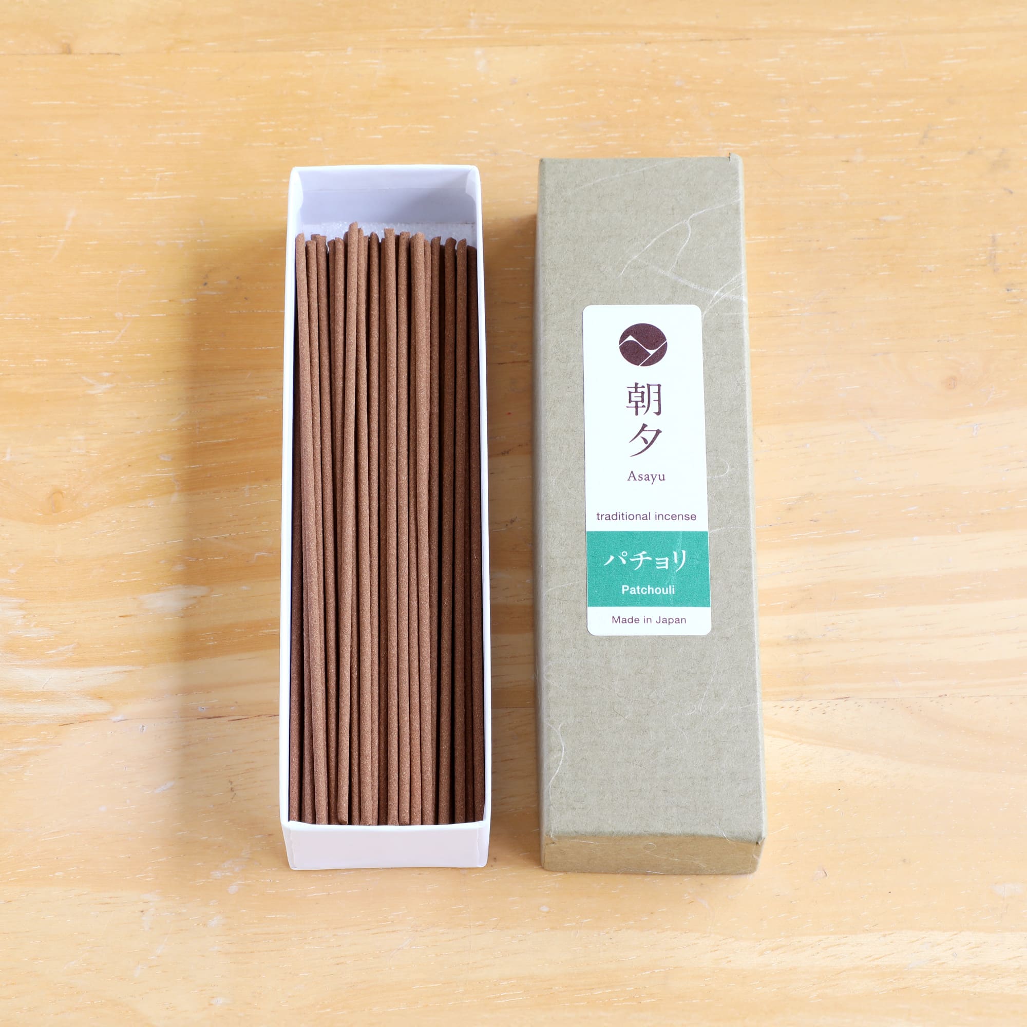 20g patchouli incense sticks box on woody background