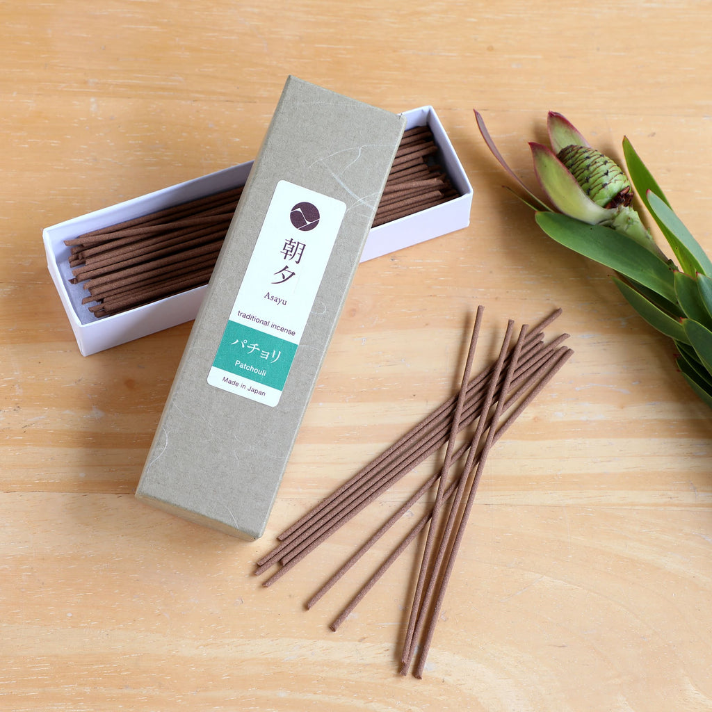 20g patchouli incense on woody background