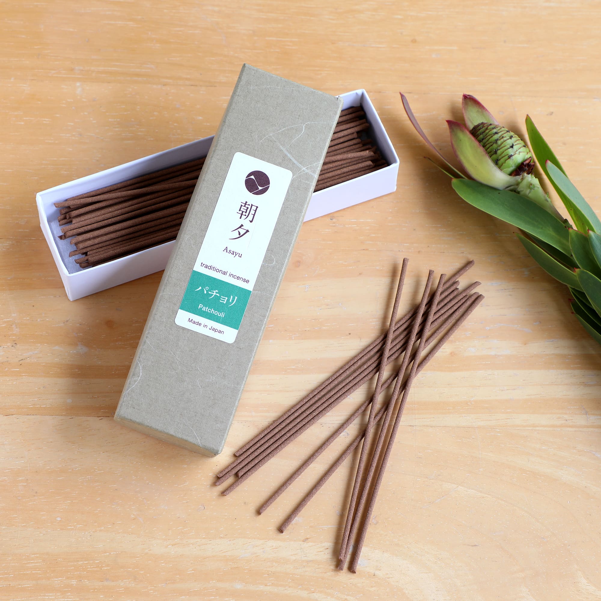 20g patchouli incense on woody background