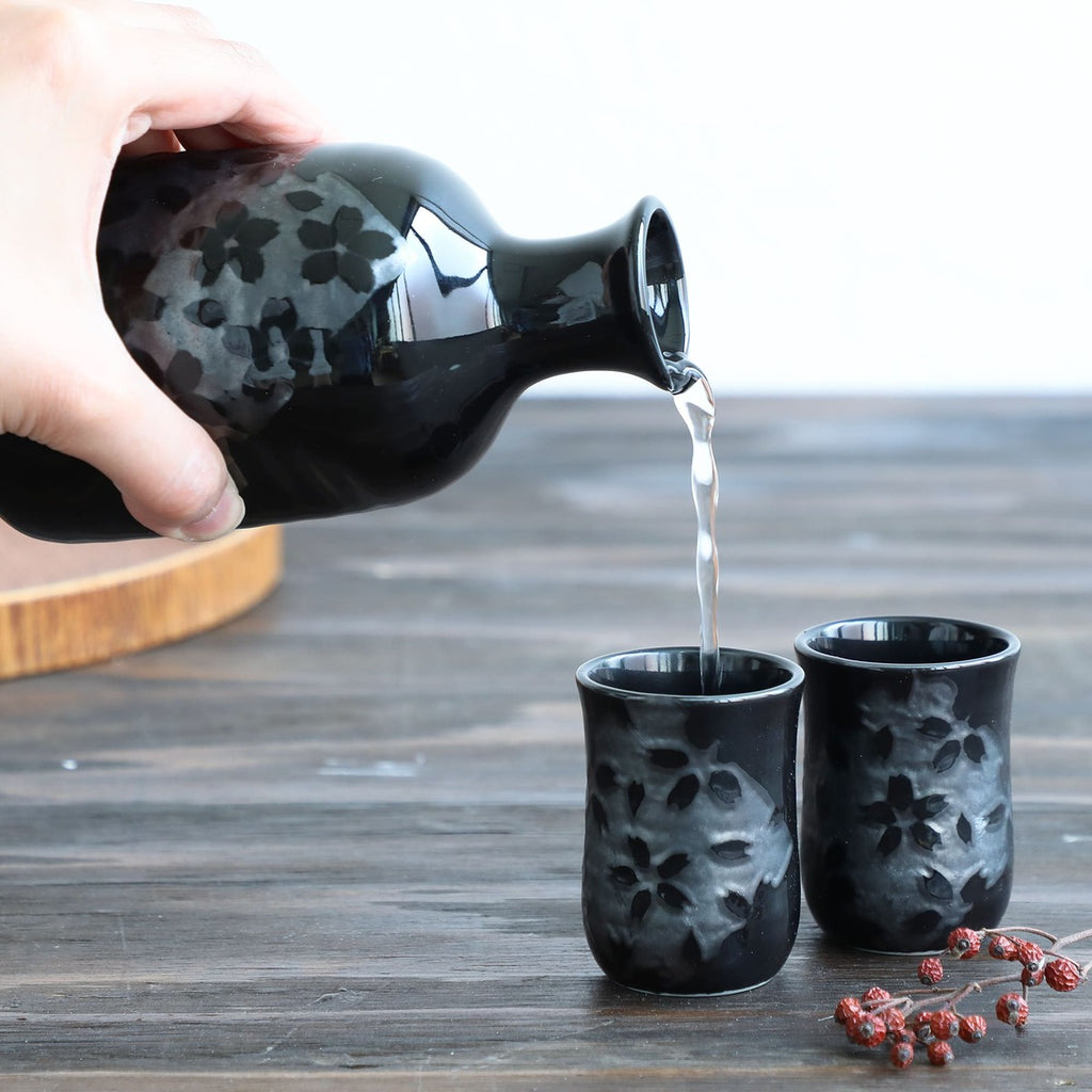 sake carafe pouring sake in cup