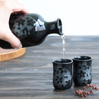 sake carafe pouring sake in cup