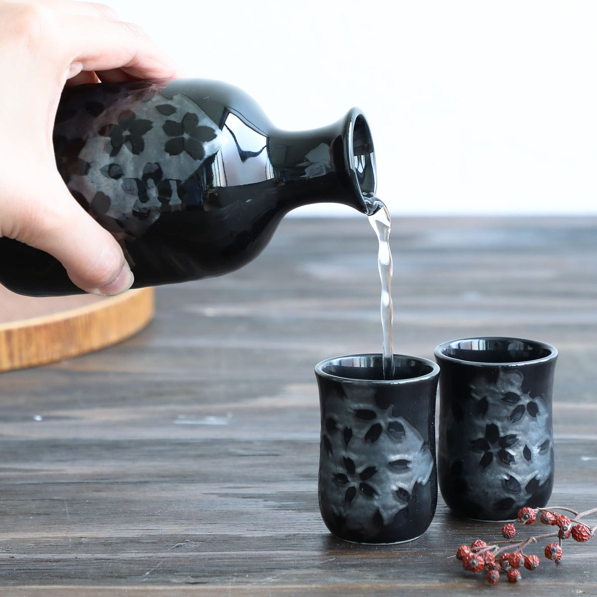 sake carafe pouring sake in cup