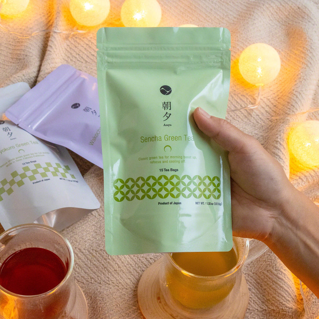 hand holding a pouch bag of asayu sencha green tea