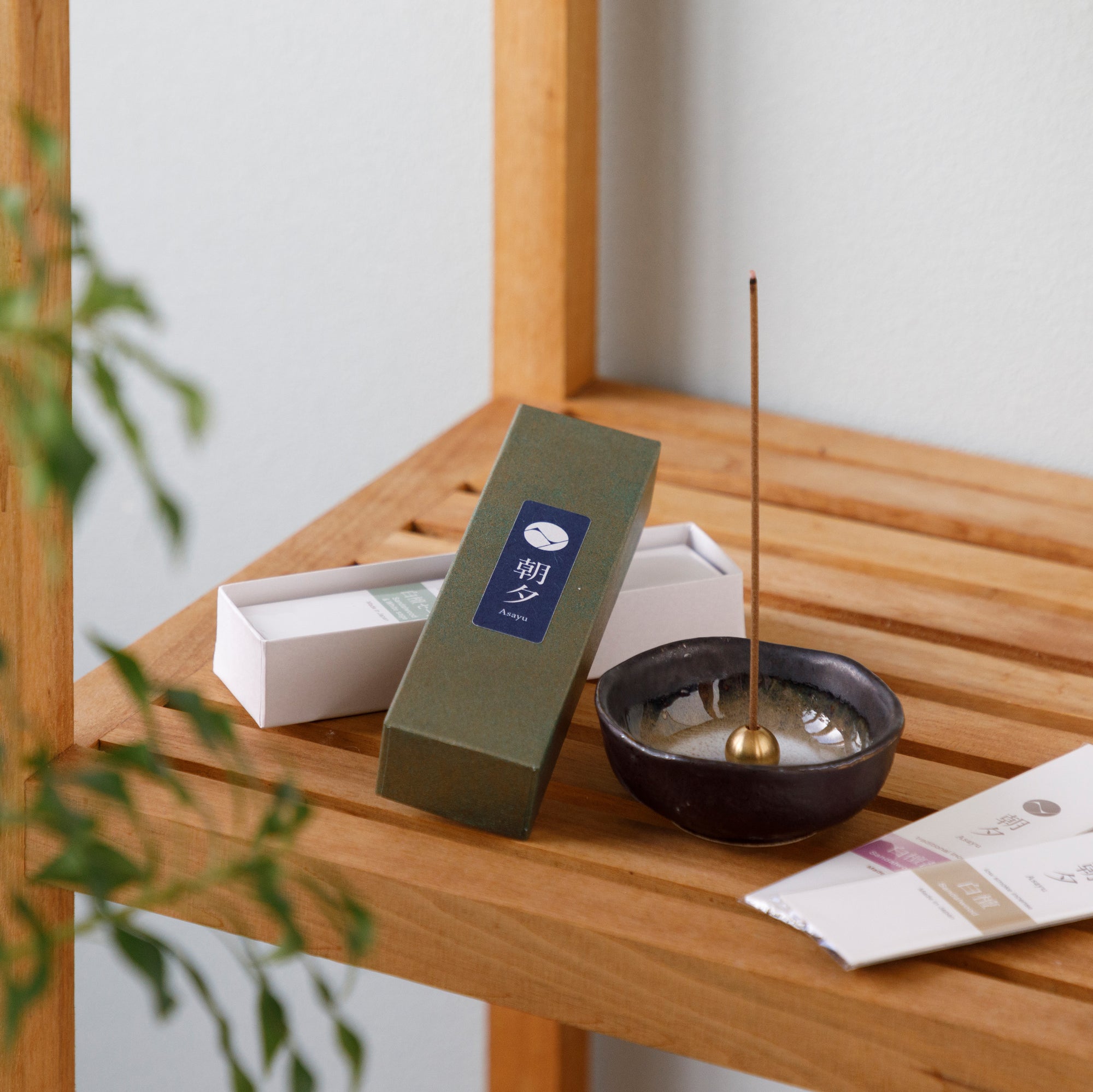 Sandalwood variety pack and incense holder on a wood shelf