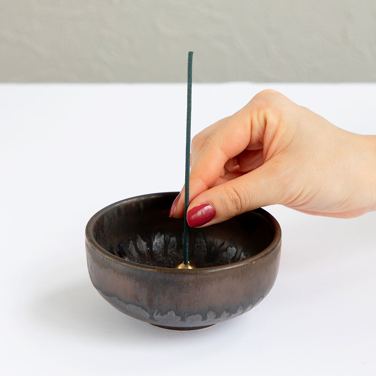 zen ceramic incense holder with white background