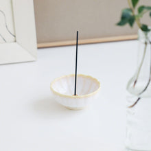 Load image into Gallery viewer,  White and Yellow Mini Lotus Incense Holder by Asayu Japan with a stick in a desk.
