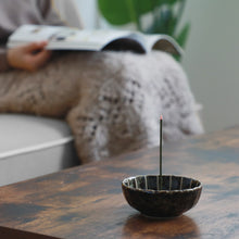 Load image into Gallery viewer, Asayu Japan Dark Green Lotus Incense Holder with burning incense Stick in a cozy living room with someone relaxing while reading a magazine
