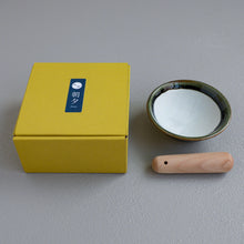 Lade das Bild in den Galerie-Viewer, Picture of the Ceramic Olive Green Mortar Bowl and Pestle Set with the packaging box with the Asayu Japan logo.
