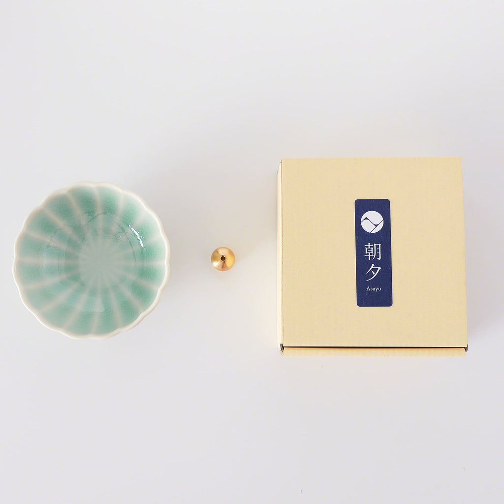 Asayu Japan Turquoise Mini Lotus Flower Incense Plate next to the included brass incense stand and the packaging box.