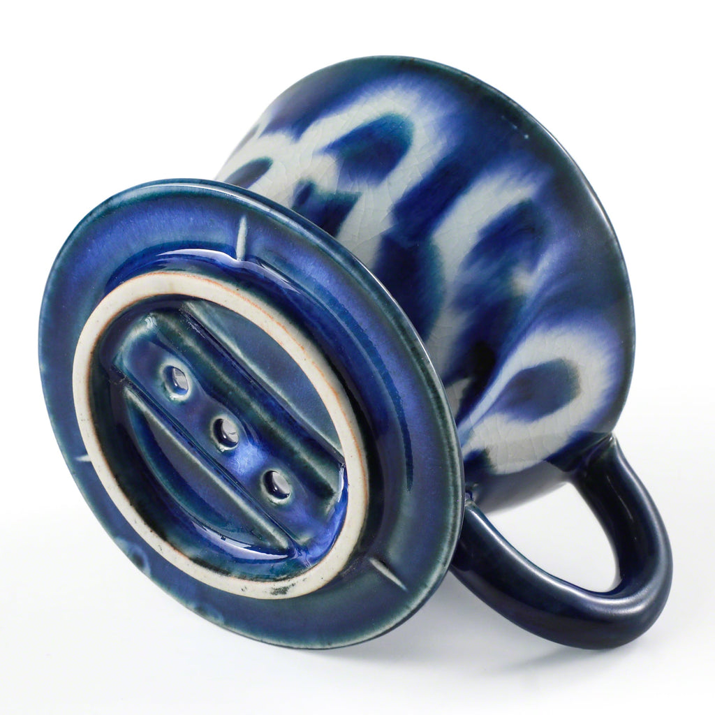 Bottom of the Asayu Japan Ceramic Coffee Dripper Ocean model with the 3 filter holes.