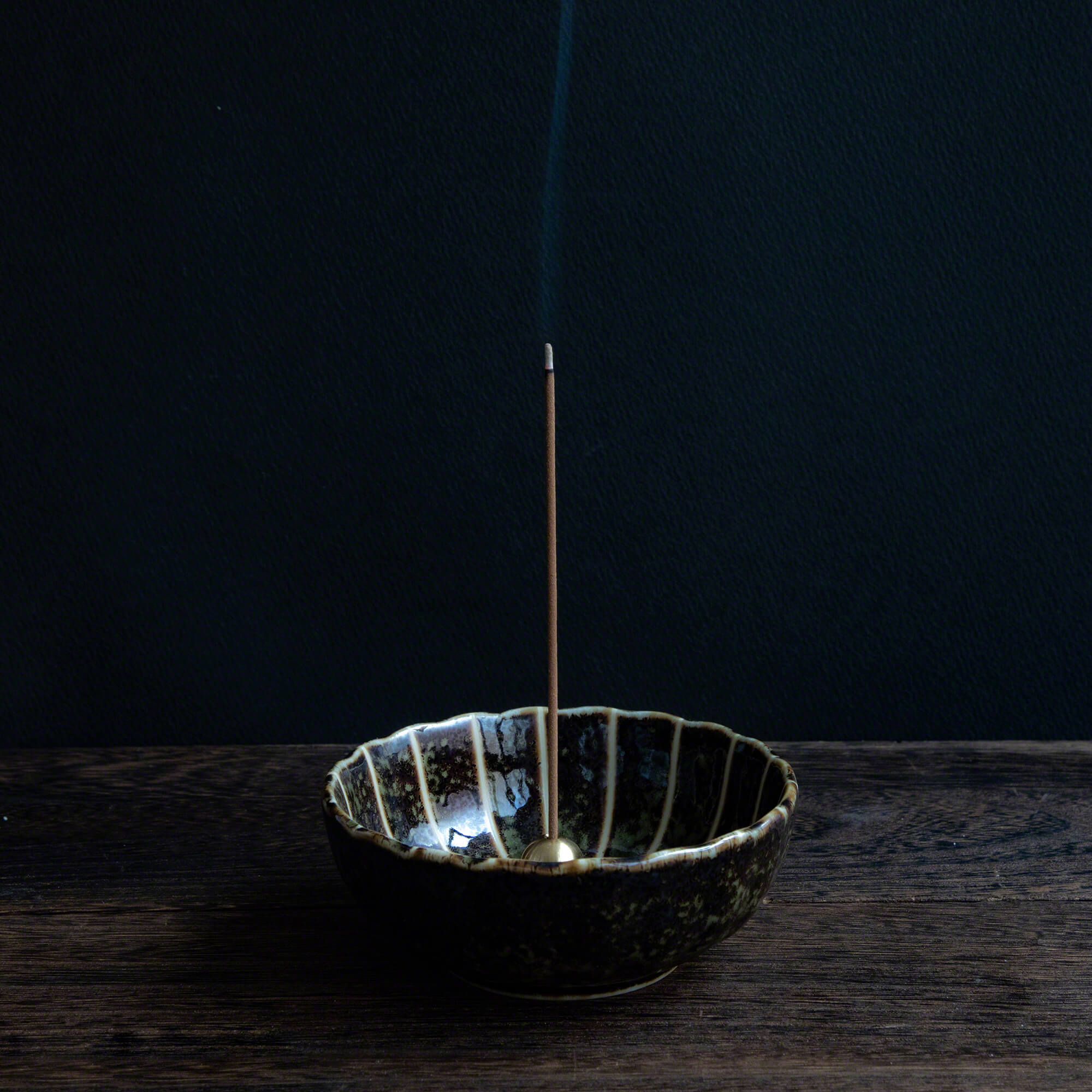 Cedar Wood incense sticks burning in an incense holder