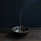 Hinoki Cypress incense sticks burning in an incense holder