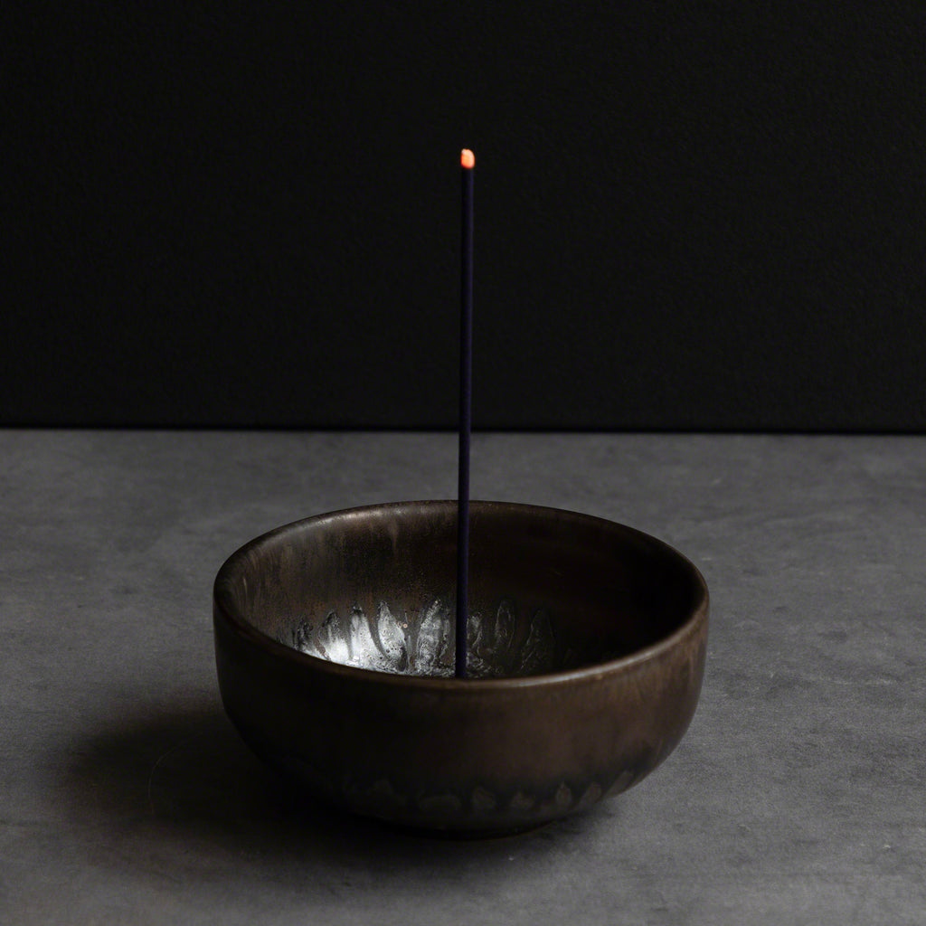 Wagiku Japanese Chrysanthemum incense stick burning in an incense holder