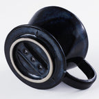 Bottom of the Asayu Japan Ceramic Coffee Dripper in dark navy blue with the 3 filter holes.
