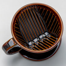 Cargar imagen en el visor de la galería, View from the top of the Asayu Japan Ceramic Coffee Dripper in chocolate brown with the 3 filter holes.
