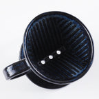 View from the top of the Asayu Japan Ceramic Coffee Dripper in dark navy blue with the 3 filter holes.