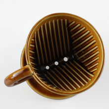 Load image into Gallery viewer, View from the top of the Asayu Japan Ceramic Coffee Dripper in caramel with the 3 filter holes.
