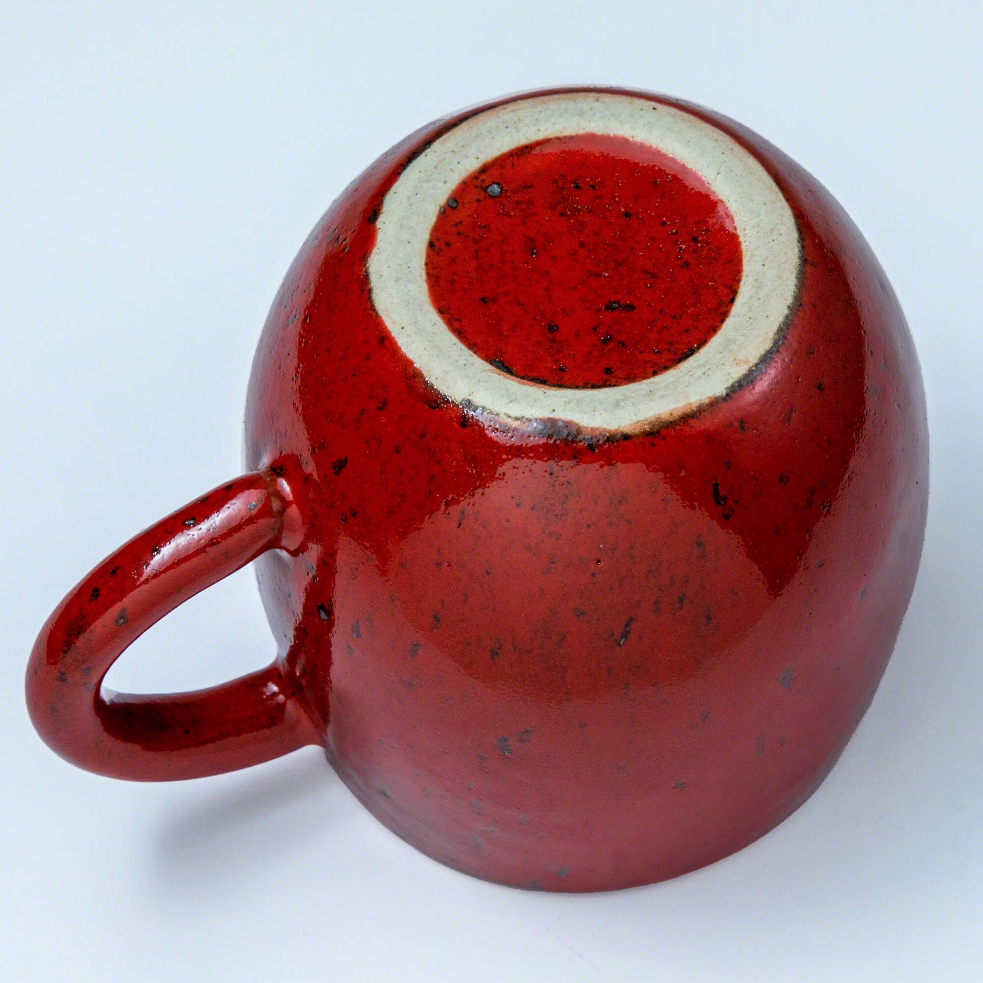 Bottom of the Asayu Japan Ceramic Coffee Mug in chrome red.