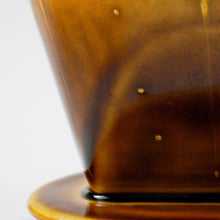 Load image into Gallery viewer, Close-up of the glaze in the Asayu Japan Ceramic Coffee Dripper in Caramel..

