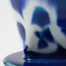 Load image into Gallery viewer, Close-up of the glaze in the Asayu Japan Ceramic Coffee Dripper Ocean model in blue with abstract white pattern.
